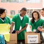 Organized group of multi-ethnic college student volunteers collect clothing donations for recent disaster relief efforts.